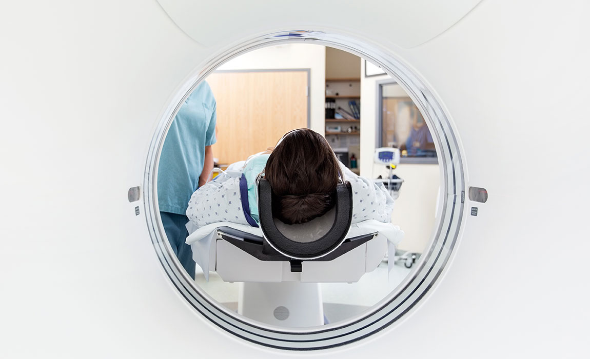 A view from inside a medical scanner as a patient lies in it