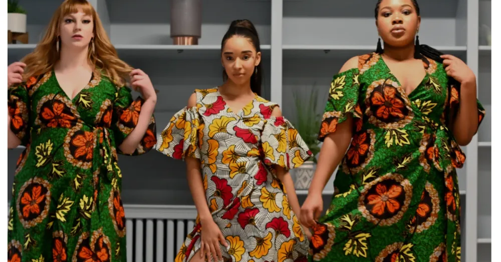 Three women in colorful gowns