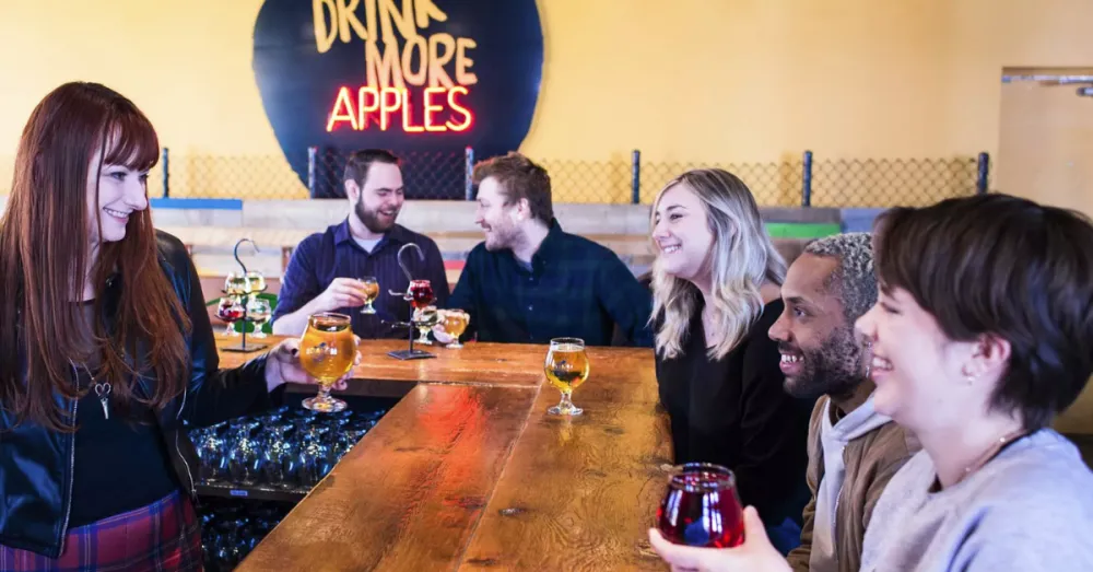 People at Chain Yard Cidery drinking cider