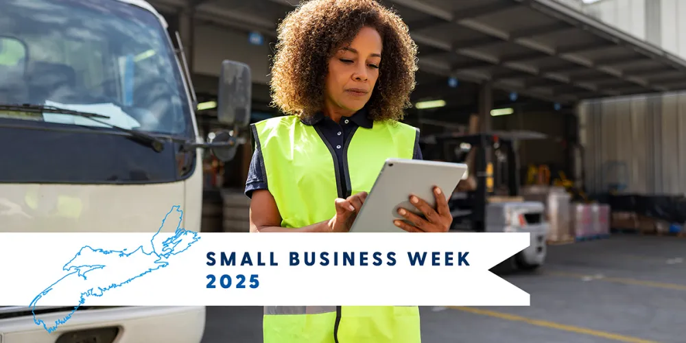 A photo of a woman in a safety vest holding a tablet device, with trucks in the background. A banner says Small Business Week 2025 next to an outline of Nova Scotia.