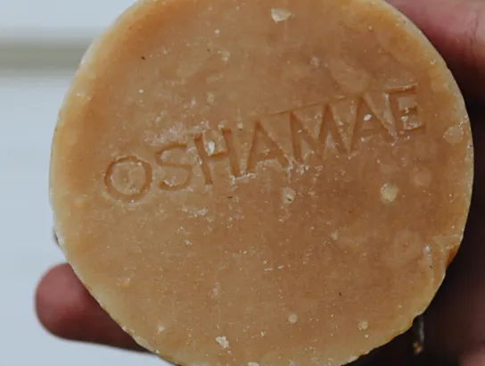 Round light natural brown coloured soap