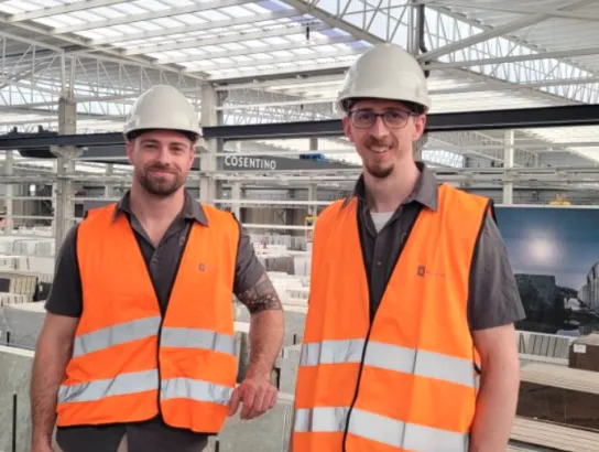 Two men in orange safety vests