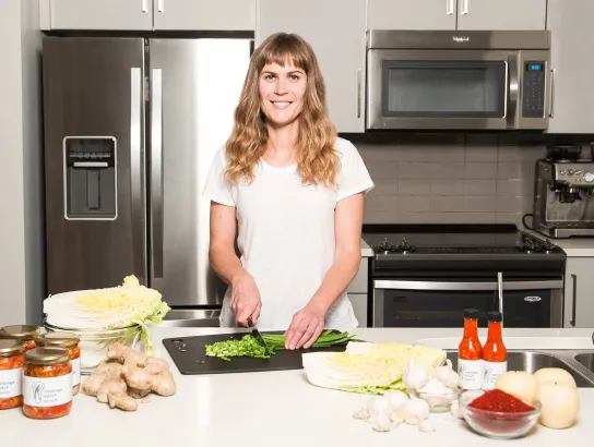 Woman chopping vegetables in kitchen