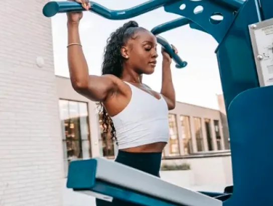 Woman working out on outdoor terrace