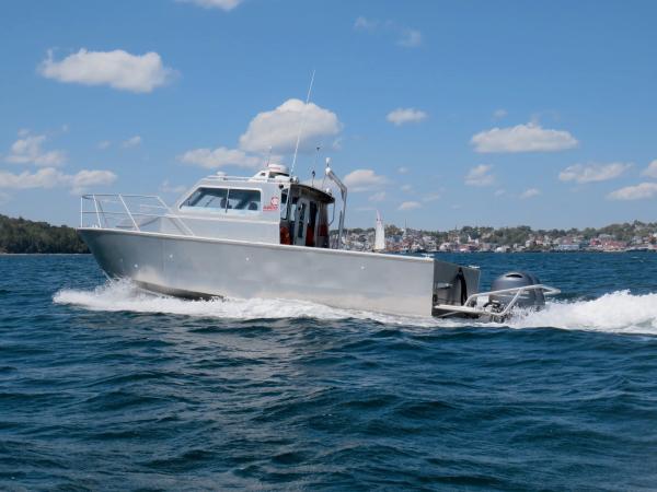 ABCO's 31' Service Boat (ideal for aquaculture and commercial use) on ocean