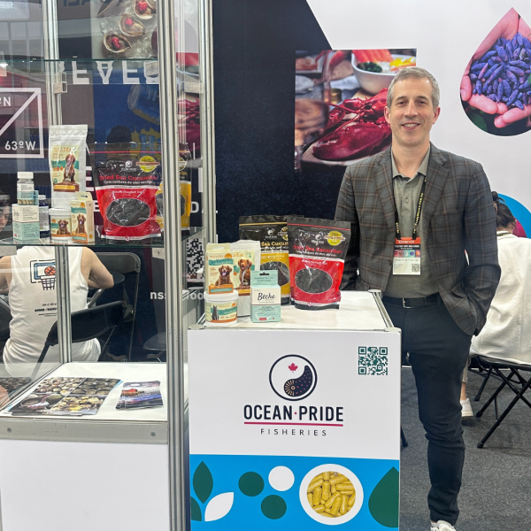 Man at food show exhibiting products for Ocean Pride Fisheries