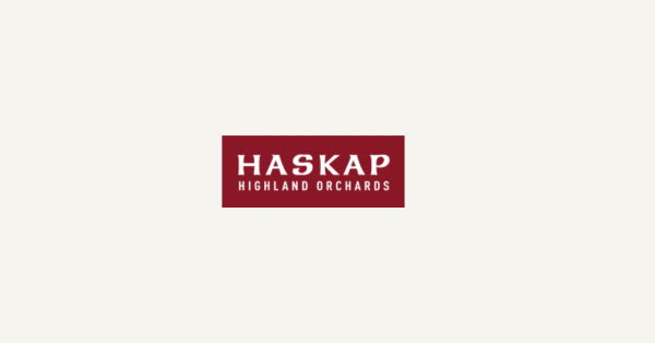 White lettering on burgundy background depicting logo for Haskap Highland Orchards