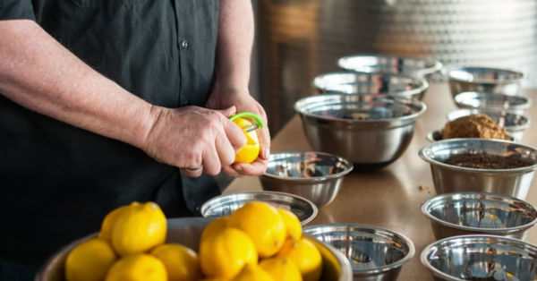 Man peeling lemons
