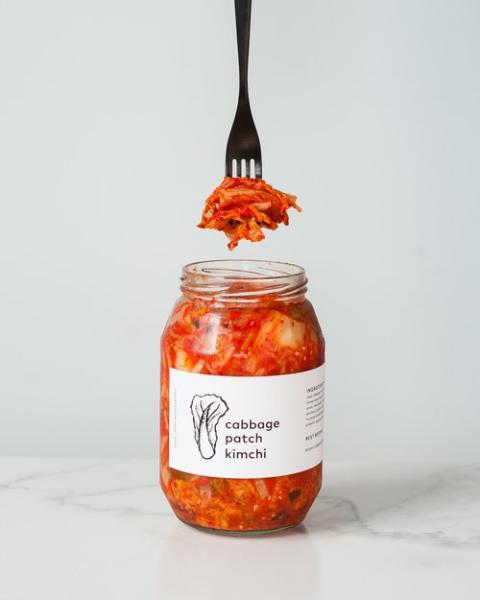 Bottle of kimchi with a fork
