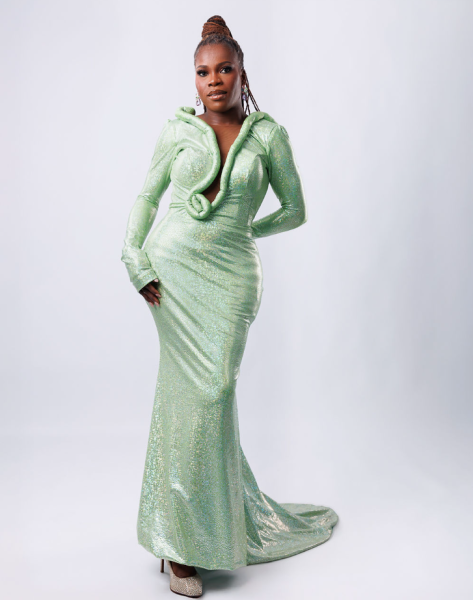 Woman posing in a light green gown