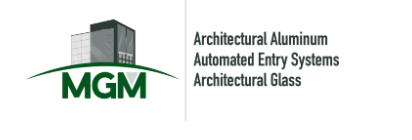 Grey silhouette of buildings sitting on top of green letters MGM