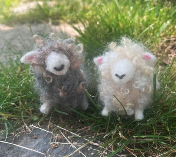 Tiny felted Cotswold sheep made from 