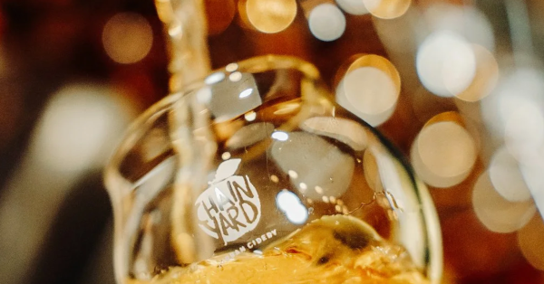 Chain Yard Cider pouring into a glass