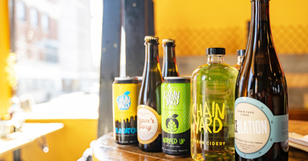 Chain Yard Cidery products displayed on a table