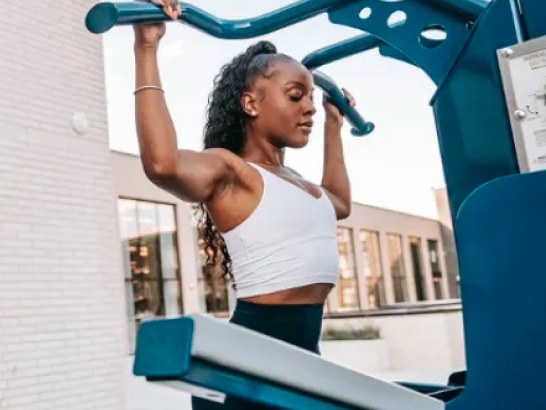 Woman working out on outdoor terrace
