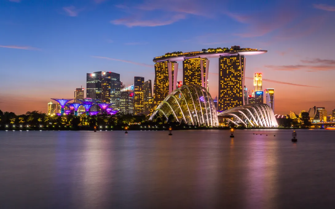 Illuminated skyline and cityscape of Singapore by the Gardens by the Bay, MBS, Marina Bay Sands and Singapore River